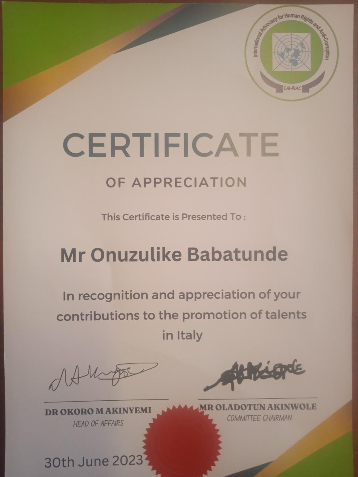Mr Onuzulike Babatunde receives an award of appreciation towards his contributions to the talents in Italy 