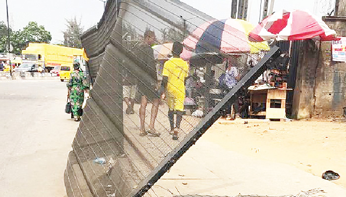 Lagos Drivers Call for Removal of Deteriorated Metal Net Barricade