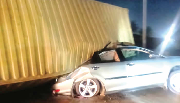 Lagos Couple Escapes Death as Container Falls on Vehicle